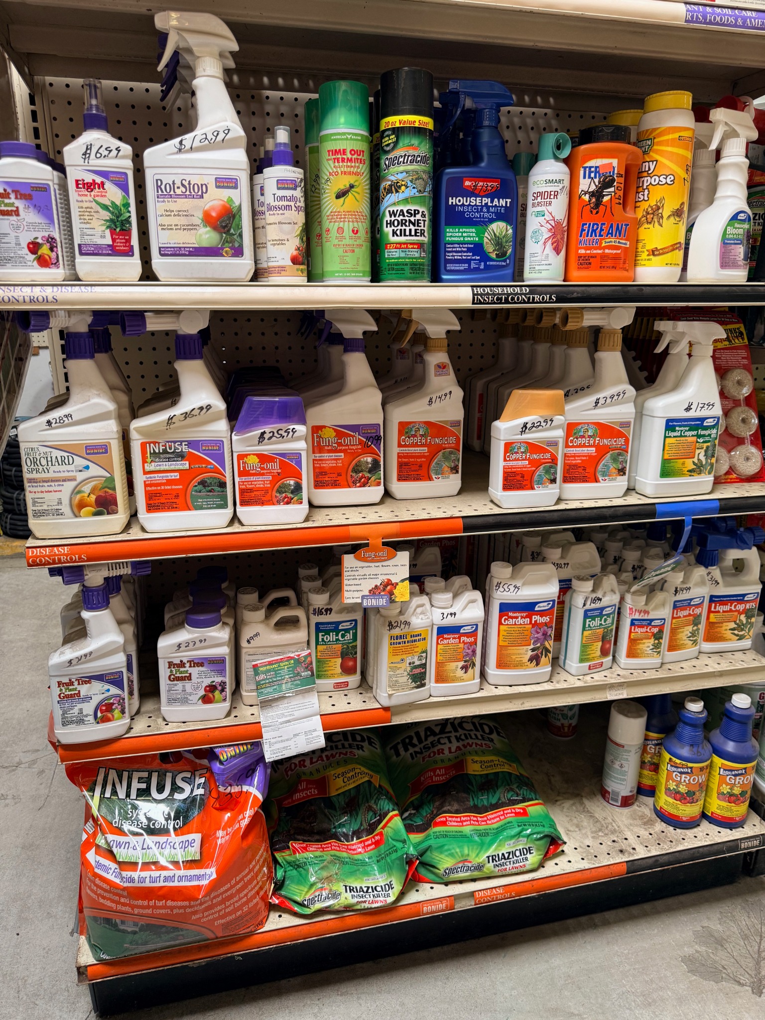 Shelf of pest and disease control products carried at Lincoln Avenue Nursery
